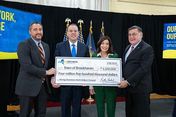 The Town of Brookhaven received a $4.5 million NY Forward grant to support redevelopment in North Bellport. Pictured left to right are New York State Secretary of State Robert Rodriguez; Brookhaven Town supervisor Daniel J. Panico; New York State Gov. Kathy Hochul and Suffolk County executive Edward P. Romaine.